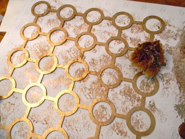 Use a sea sponge to dab the metallic paint.....